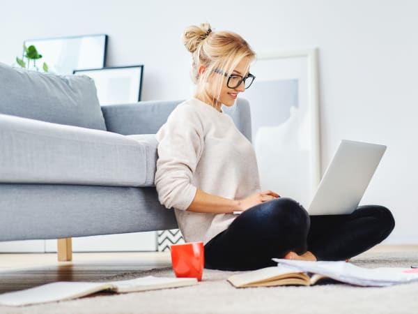 Resident working on her laptop in her luxury home at EVIVA Midtown in Sacramento, California