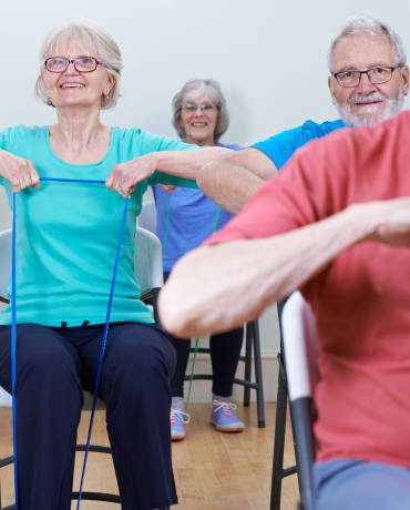 Residents participate in an exercise class at Lassen House Senior Living in Red Bluff, California