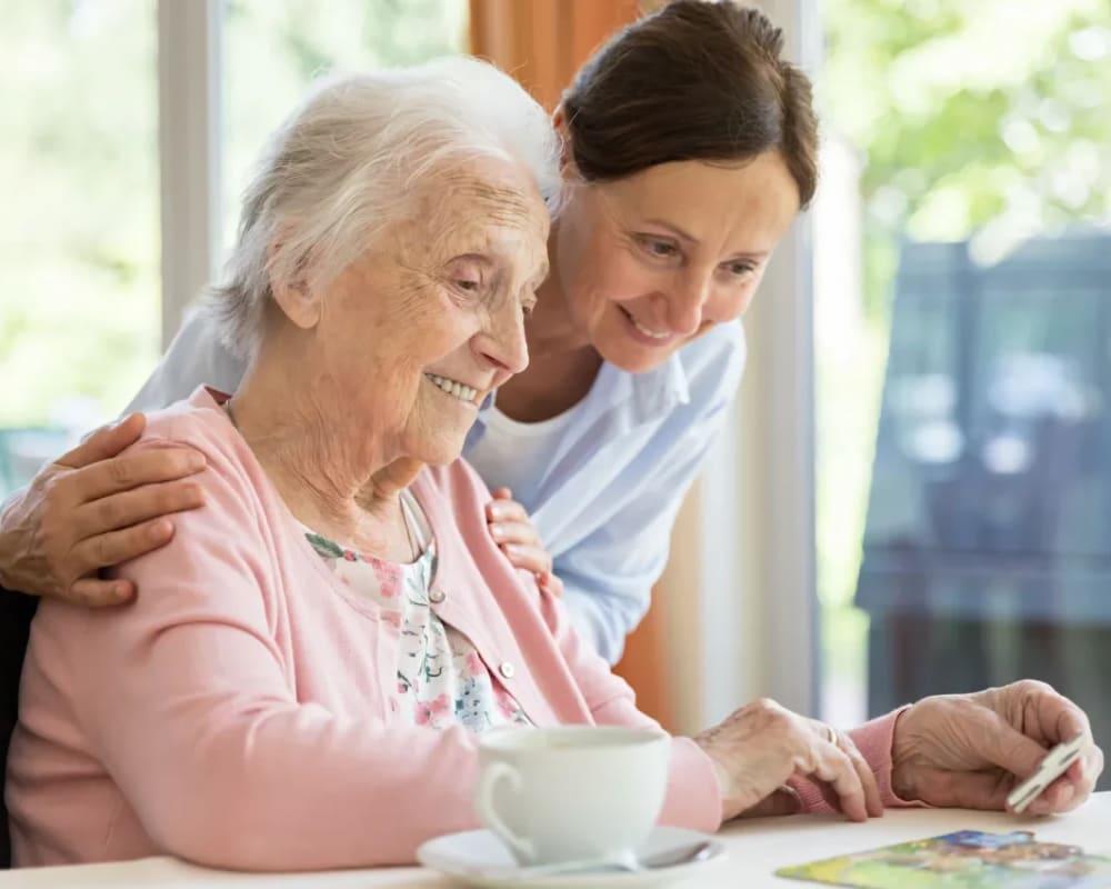 Residents assemble a jigsaw puzzle at Courtyard Estates at Cedar Pointe in Pleasant Hill, Iowa.