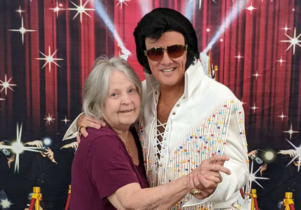 Resident dancing with an Elvis impersonator at Truewood by Merrill, Clovis in Clovis, California