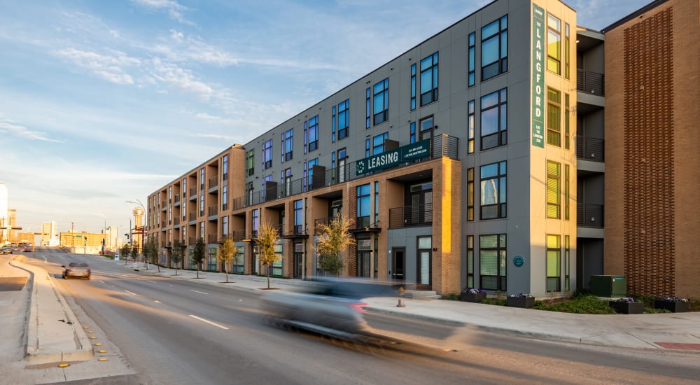 Exterior photo of street and building at The Langford in Dallas, Texas