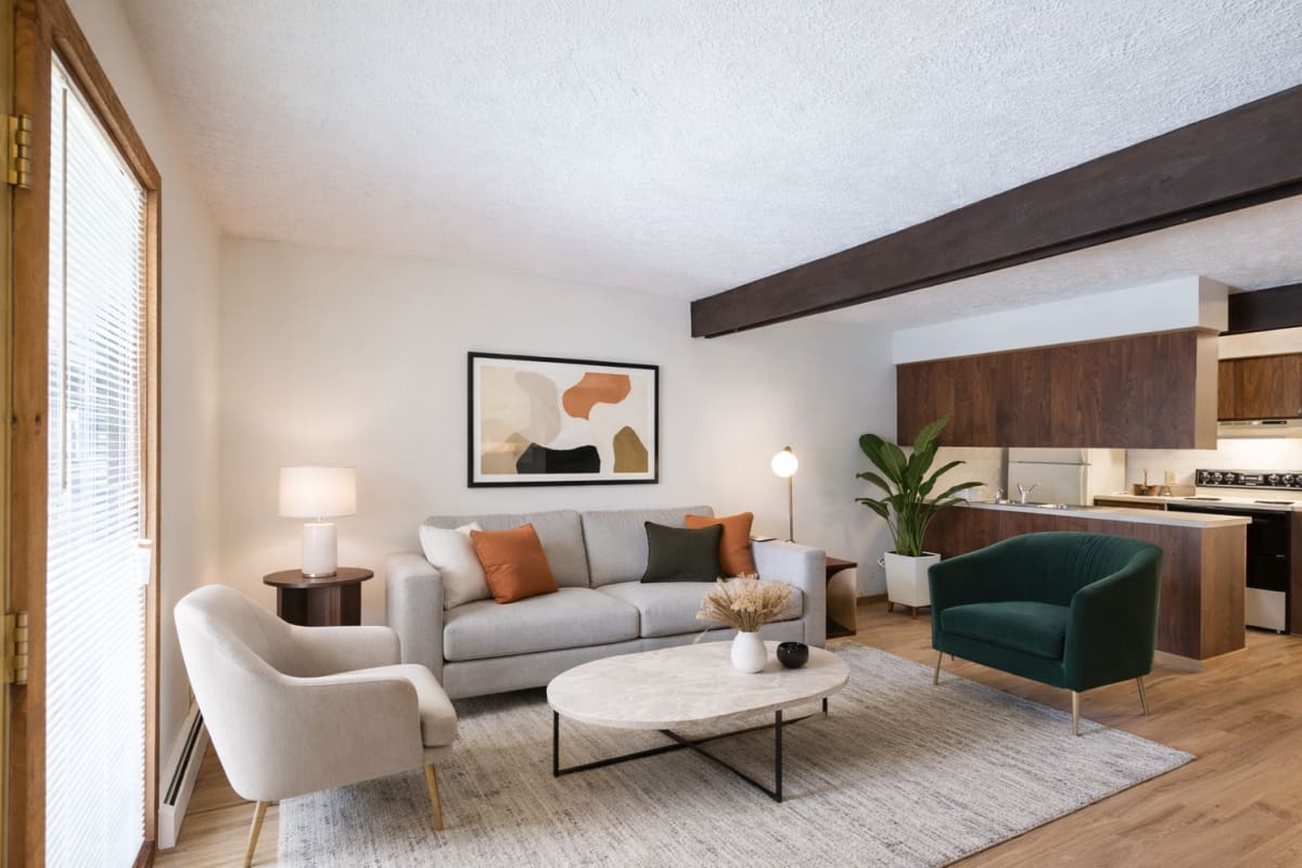 Well-equipped kitchen & living room at Merriman Valley Apartments and Townhomes in Akron, Ohio