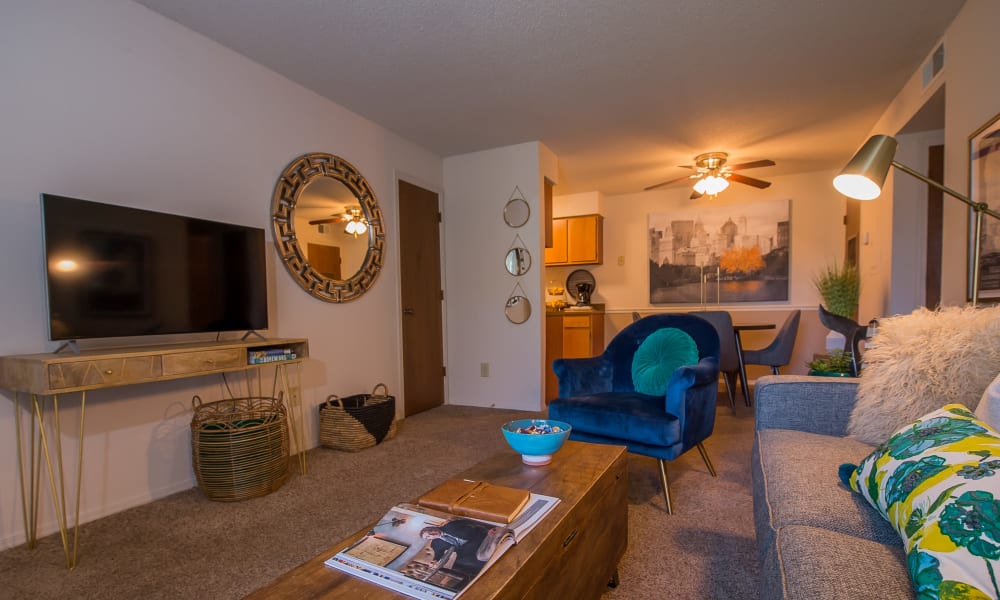 Open and bright model living room at Silver Springs Apartments in Wichita, Kansas
