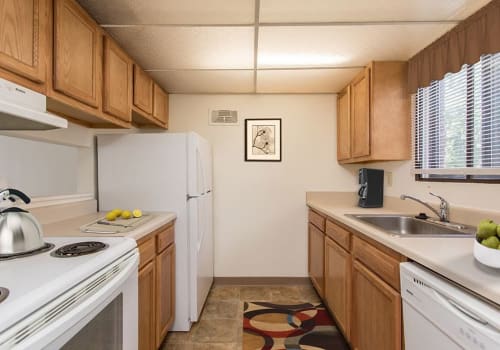 Modern, bright kitchen at High Acres Apartments & Townhomes home in Syracuse, New York
