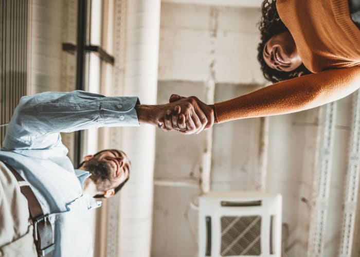 People shaking hands at a San Diego Self Storage location