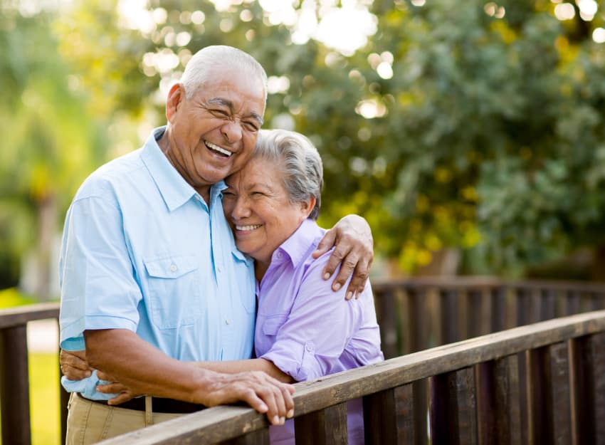 Couple hugging at Inglenook At Brighton in Brighton, Colorado