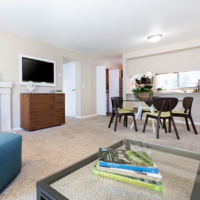 Minimalist decor in the living area of a model home at Madison Sammamish Apartments in Sammamish, Washington