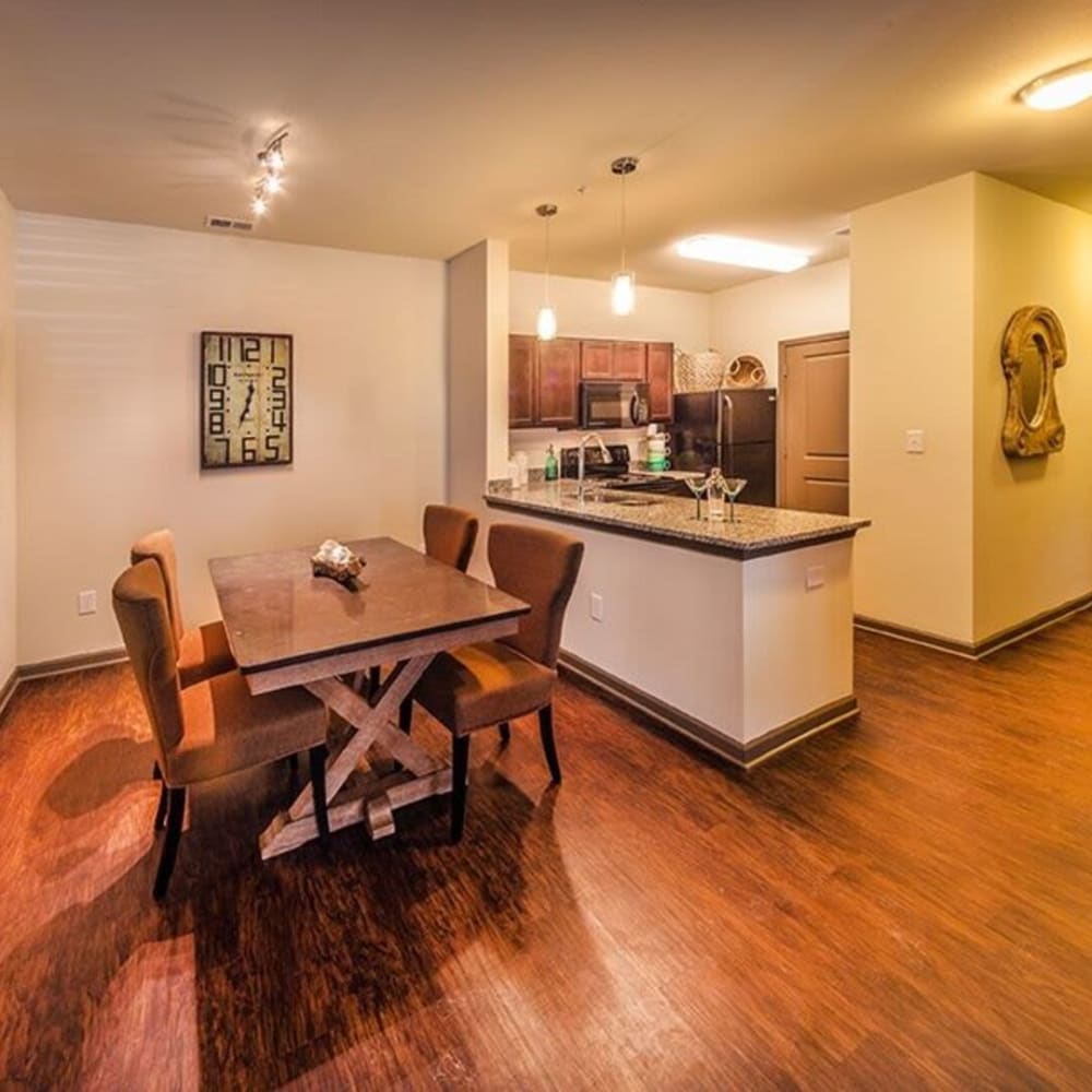 Kitchen and dining area with wood-style floor at LaCabreah, Brownsburg, Indiana