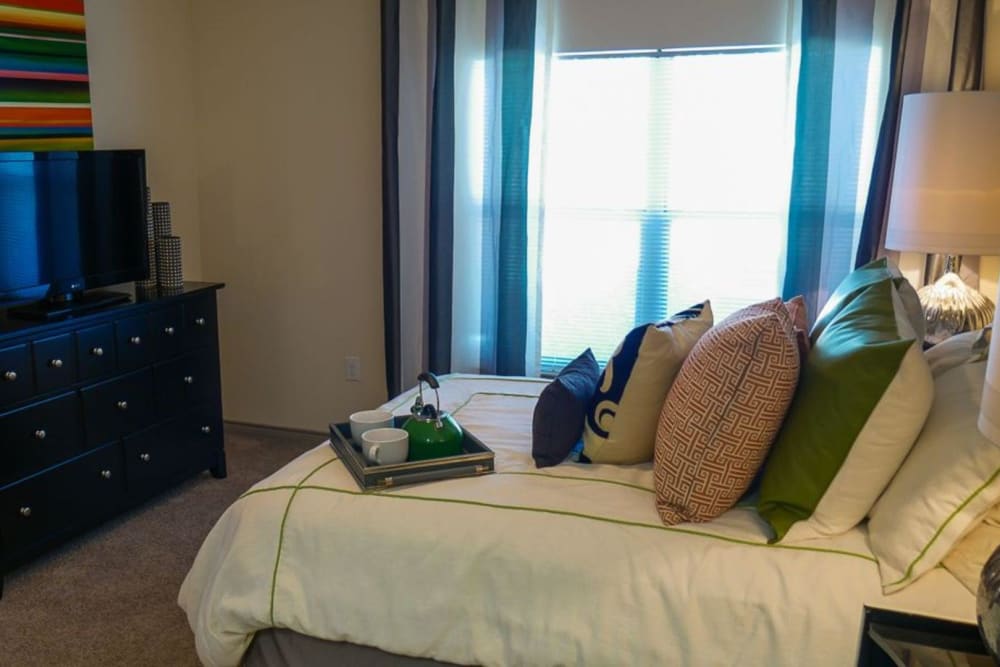 Model bedroom with plush carpeting at The BLVD in San Angelo, Texas