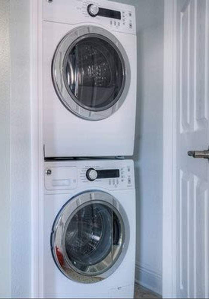 Stacked washer and dryer at Bayside Villa Apartments in South Pasadena, Florida
