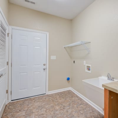 Storage and laundry area in a home at at The Village at Whitehurst Farm in Norfolk, Virginia