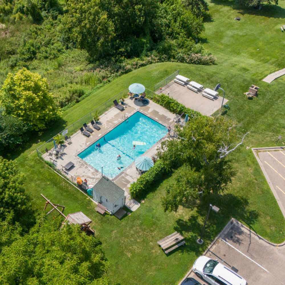 Community aerial view with swimming pool at Solace on Lake Minnetonka in Spring Park, Minnesota
