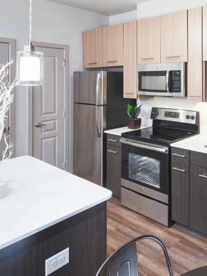 Gourmet kitchen with island seating at Anatole at the Pines in Conroe, Texas