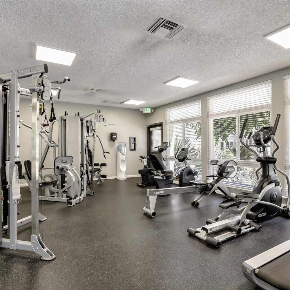Fully-equipped fitness center at Santa Teresa Apartments in San Jose, California