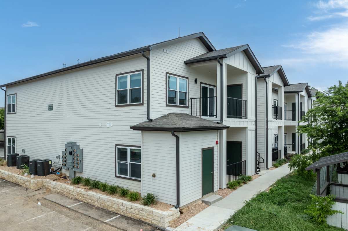 Modern duplex with charming exteriors and lush landscaping at Sangria Park in Austin, Texas.