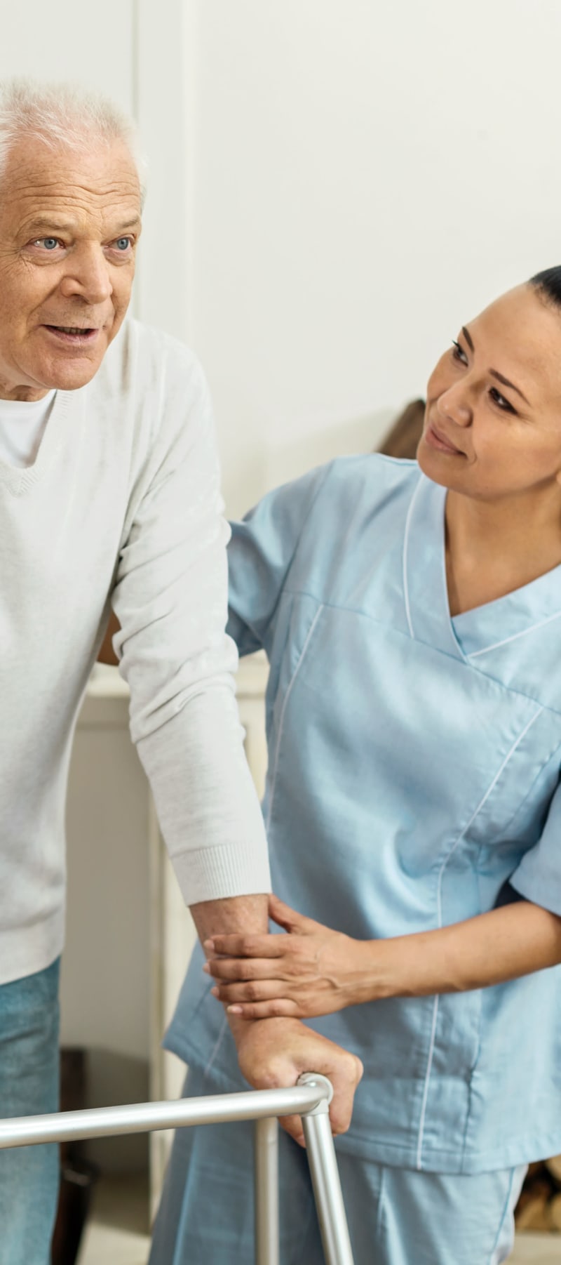 Resident working with a physical therapist and a walker at Ingleside Communities in Mount Horeb, Wisconsin