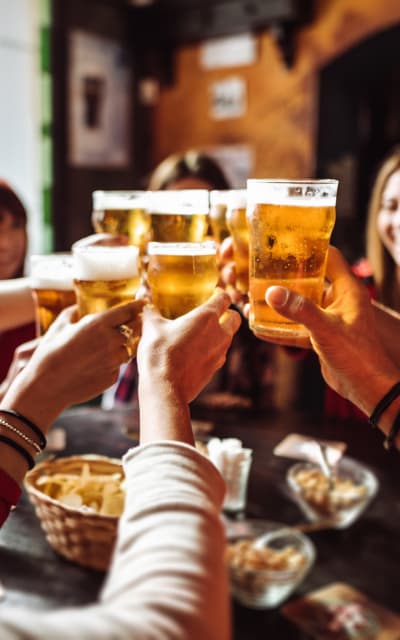 Friends enjoying drinks together at Solana Stapleton Apartments in Denver, Colorado