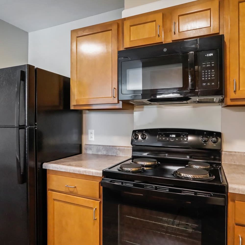 Kitchen with black appliances at Allegany Junction in Cumberland, Maryland