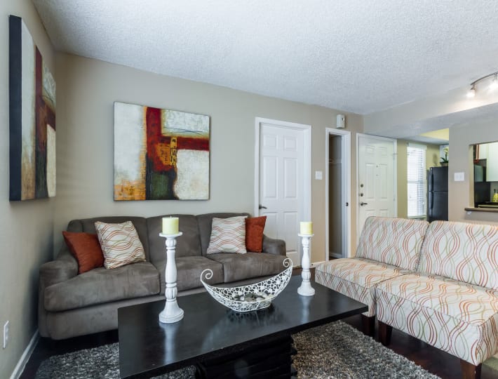 Well-lit living room at The Pointe at Ramsgate in San Antonio, Texas