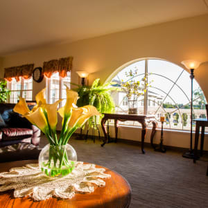 sunlit lounge with a large semicircular window at Hanover Place in Tinley Park, Illinois