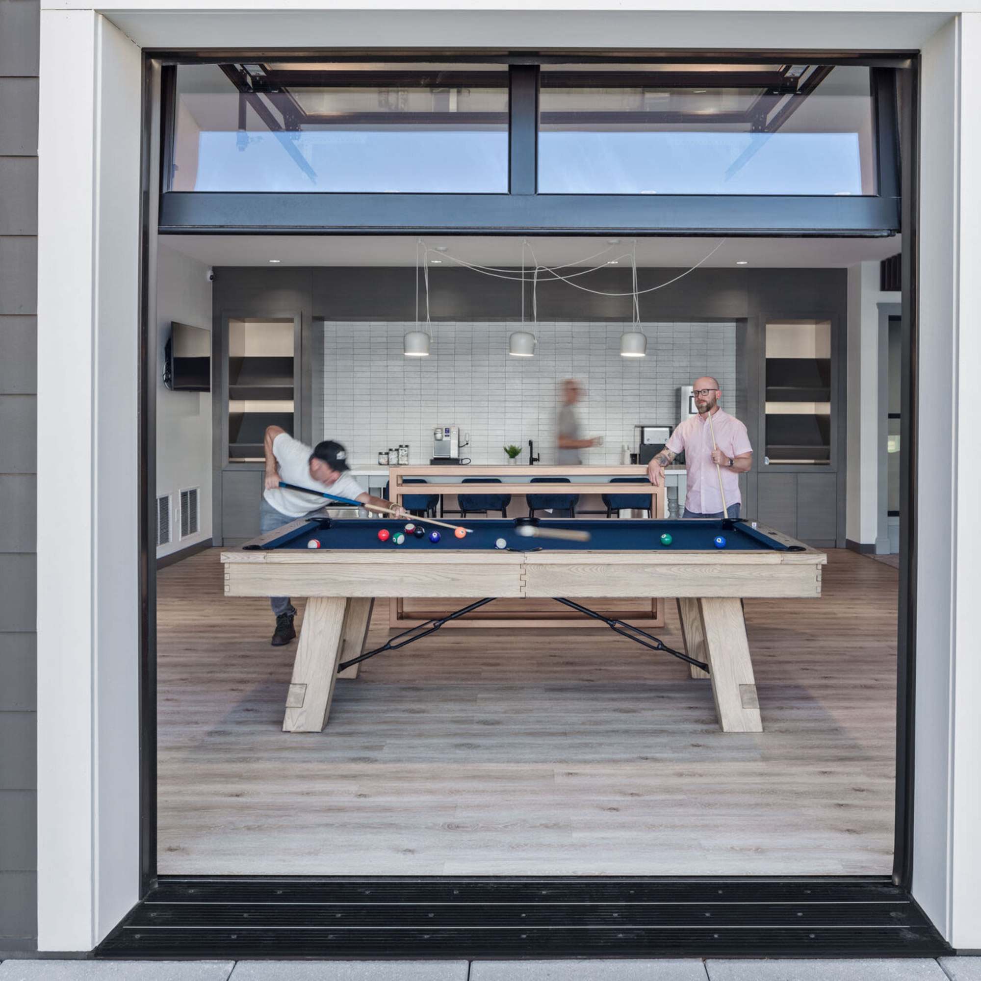 Residents playing pool table at Westmont at The Lane in Columbus, Ohio