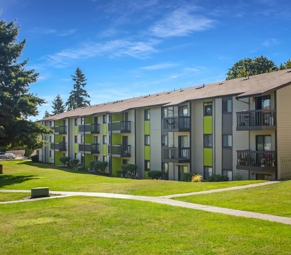 Beautiful landscape along walkways at Terra Apartment Homes in Federal Way, Washington