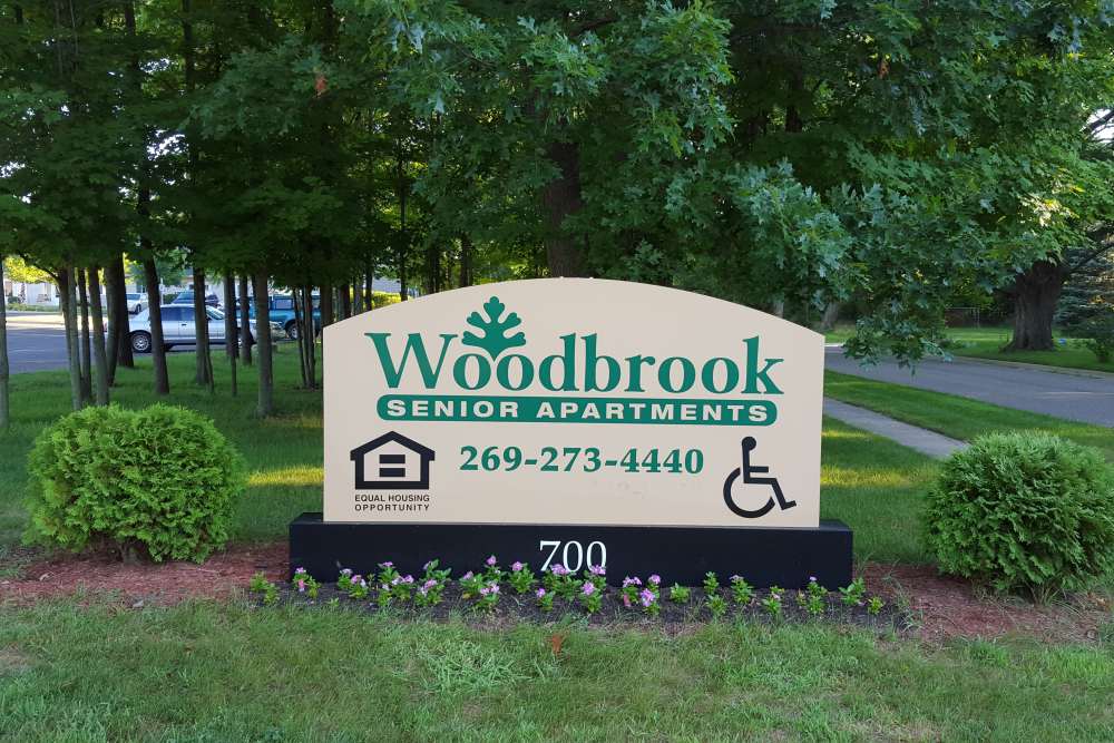 Signage of senior living apartment homes at Woodbrook Apartments in Three Rivers, Michigan