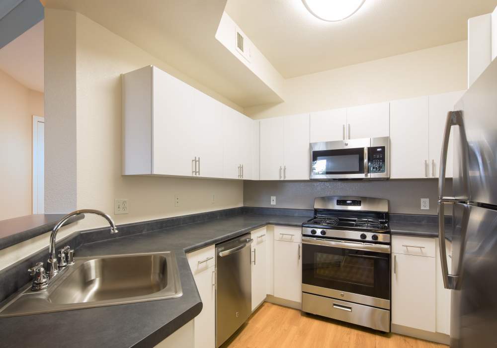 Fully equipped kitchen with drawer microwave at Park Hacienda Apartments in Pleasanton, California,