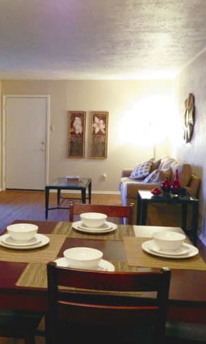 Dining area and living room in a model home at Parkway Villas in Grand Prairie, Texas