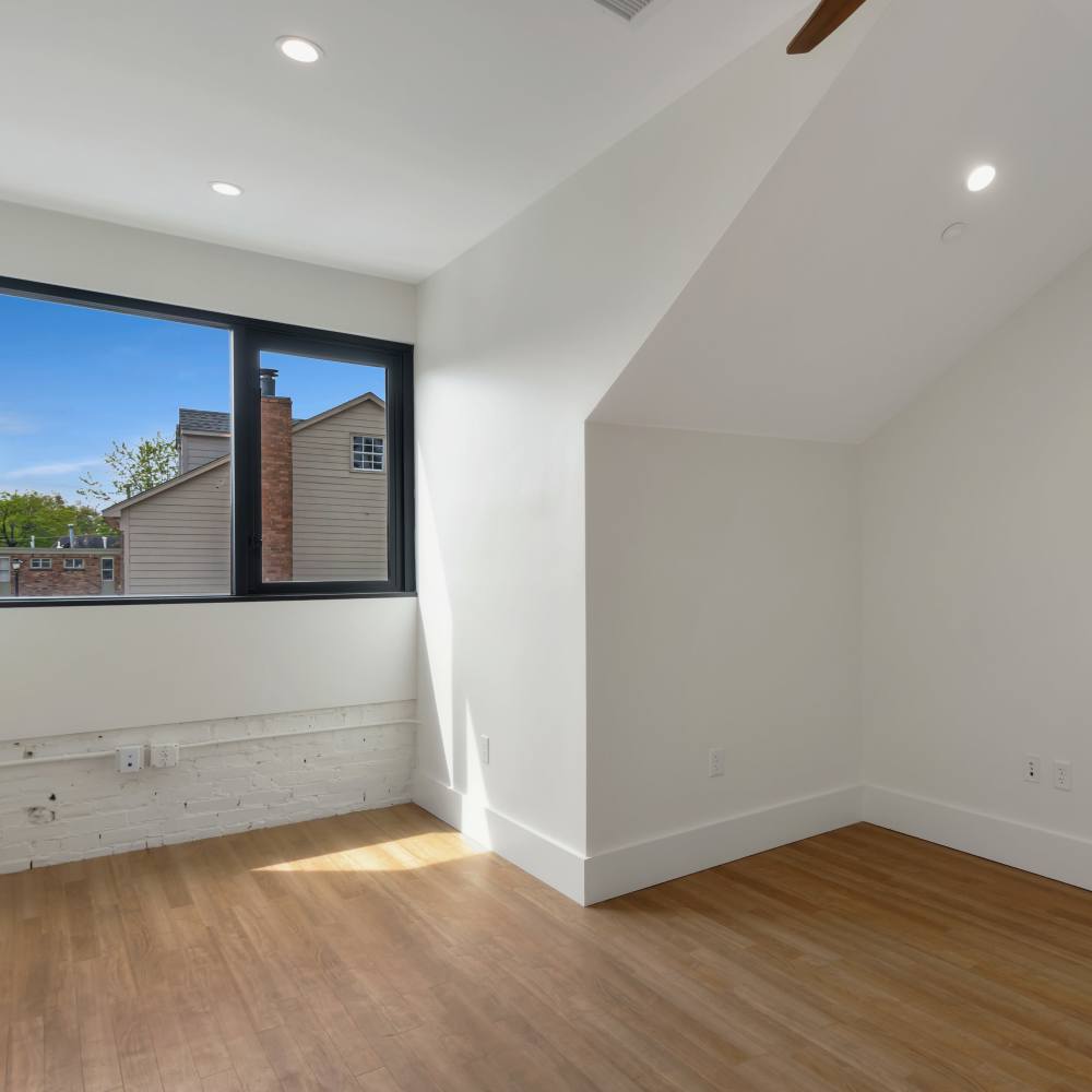 Un furnished area with wooden flooring and window at 189 Barksdale in Memphis, Tennessee