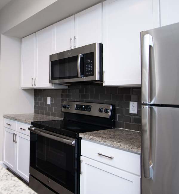 Kitchen with oven at Green Tree Place in Houston, Texas