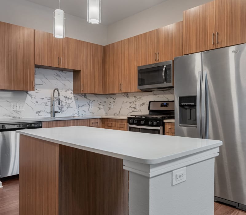 Modern kitchen with an island at Westerly 360 in Austin, Texas
