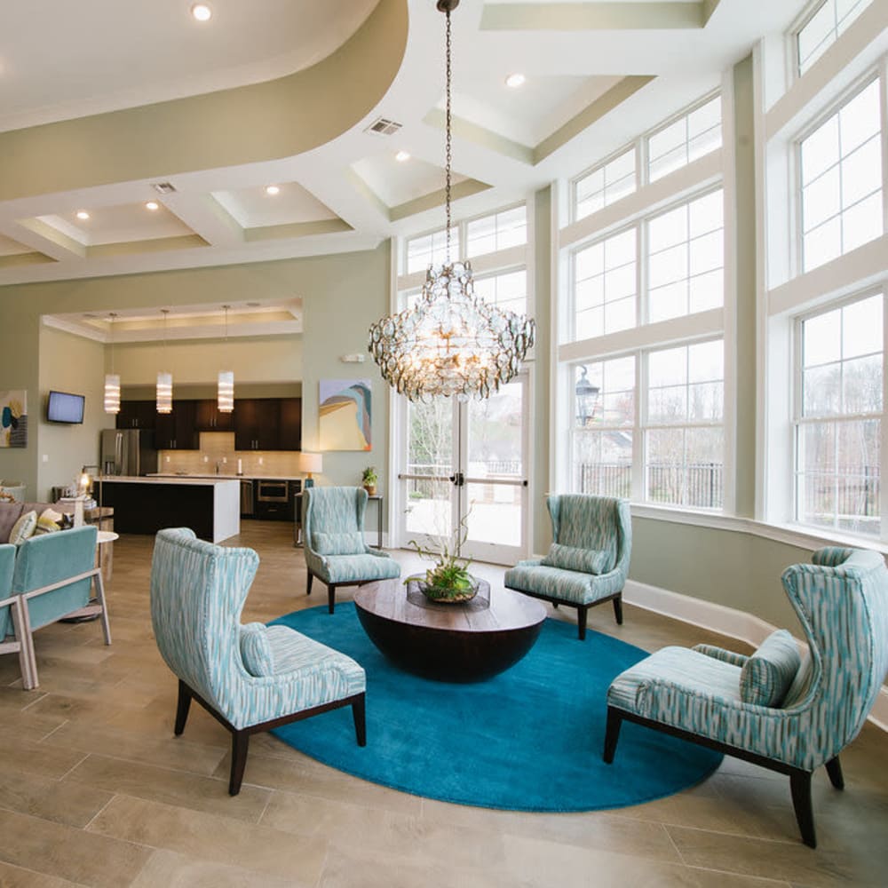 Clubhouse with comfortable seating and chandelier at Beacon on 5th in Charlottesville, Virginia 