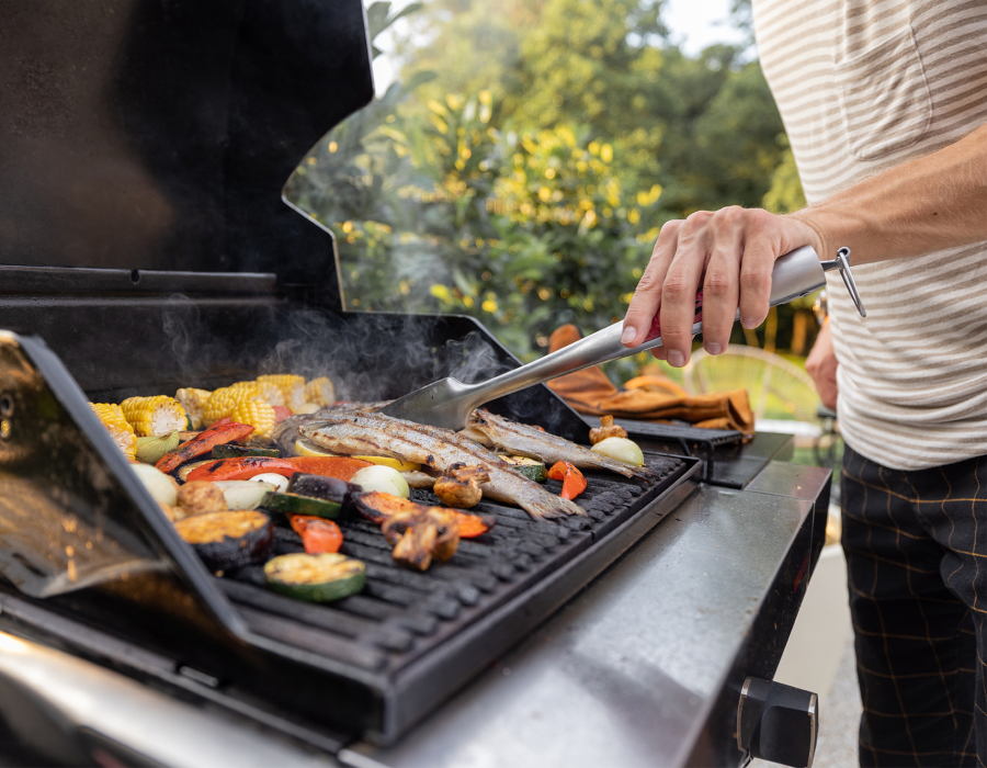 Resident grilling outside at Van Mark Ridgeland in Ridgeland, Mississippi