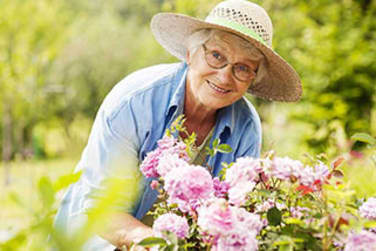 Residents Gardening at Grand Villa of Deerfield Beach in Deerfield Beach, Florida