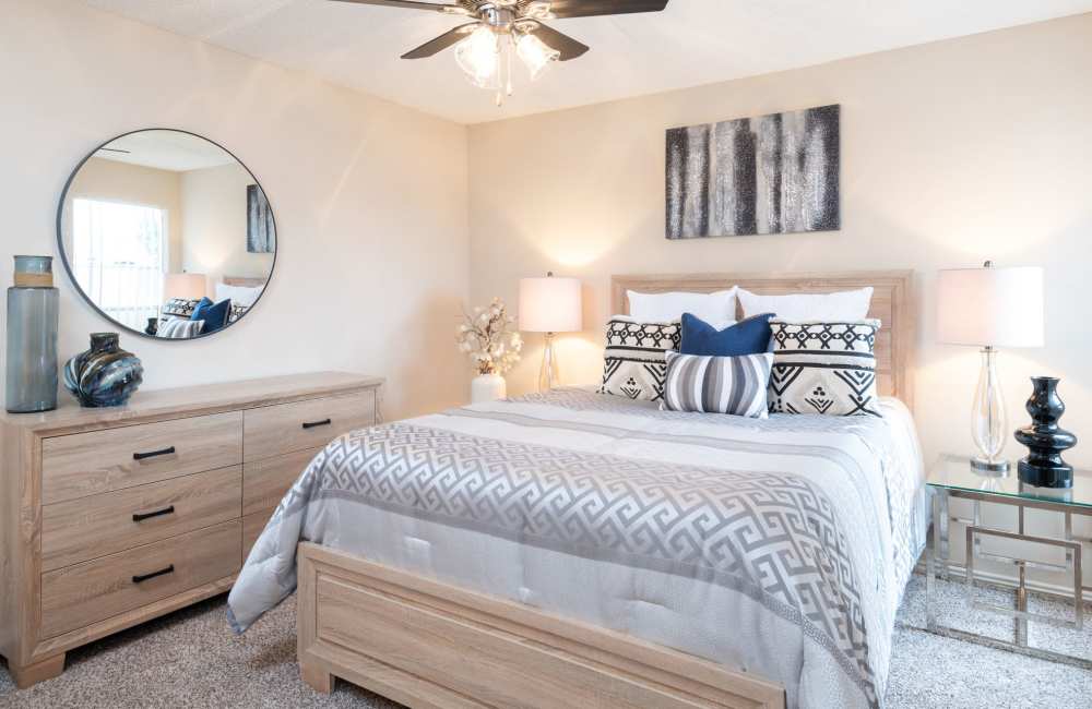Charming bedroom with a cozy atmosphere, stylish décor, and natural light at Charter Oak in Euless, Texas.