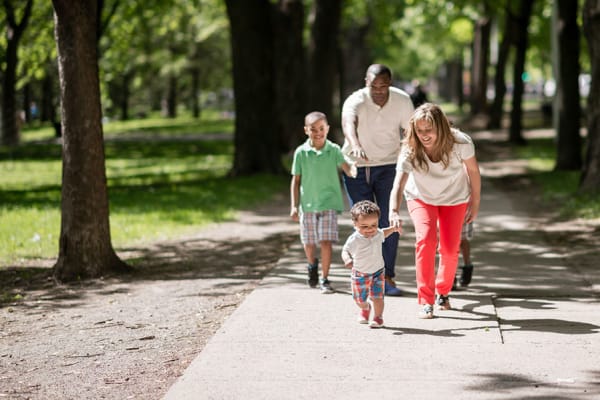 Family going on a walk together near The Lakes at 8201 in Merrillville, Indiana