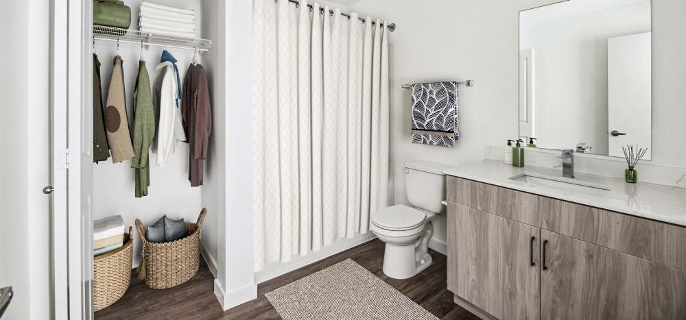 Bathroom showing a vanity mirror and lights at Allegro in Lynnwood, Washington 