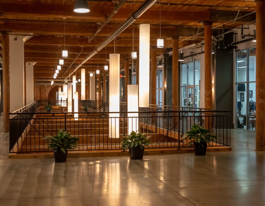 Outdoor couch and chairs covered by wooden structure at Loray Mill Lofts in Gastonia, North Carolina