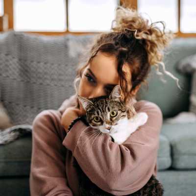 Resident holding her cat in their home at Collins Preserve in Jacksonville, Florida