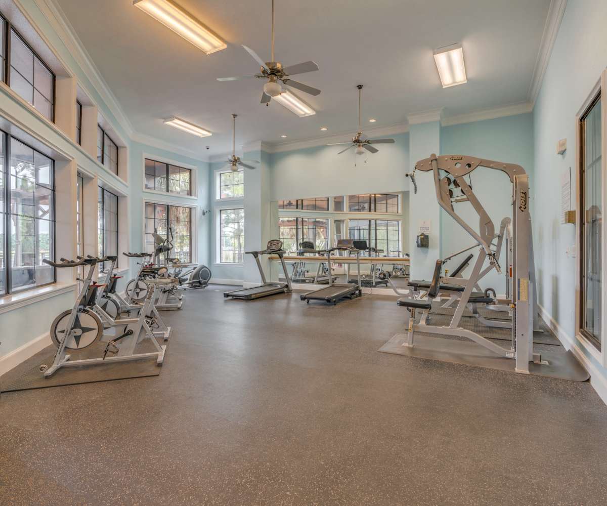 A gym featuring various exercise equipment and ceiling fan at Edgewater at Klein in Spring, Texas