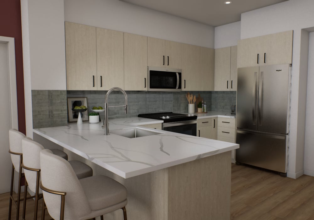 Open layout kitchen with granite countertops at The Colton in Redwood City, California