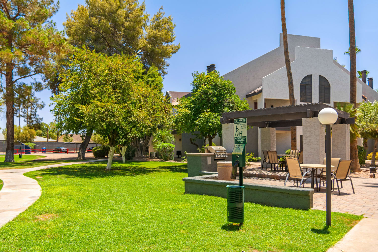 Exterior of community building and pet cleanup station at Waterford Place Apartments in Mesa, Arizona