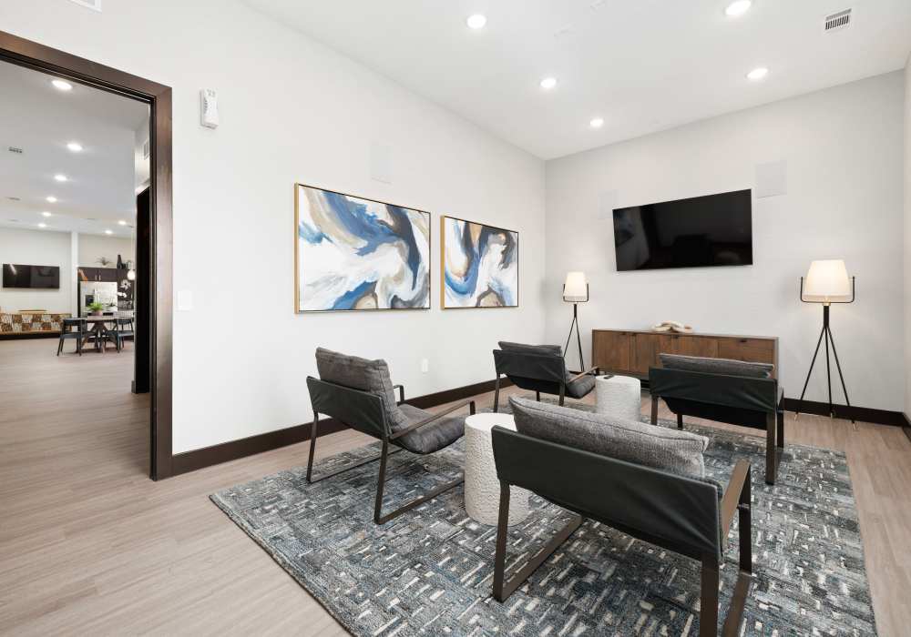 Lounge area with modern seating and carpet at Balcones Trails in Kyle, Texas
