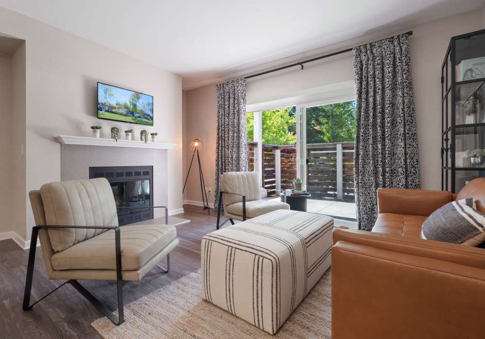 Spacious living room with large sofa and coffee-table at Cotton Wood Apartments in Dublin, California,