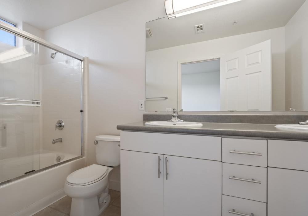 Bathroom with vanity unit at Park Hacienda Apartments in Pleasanton, California