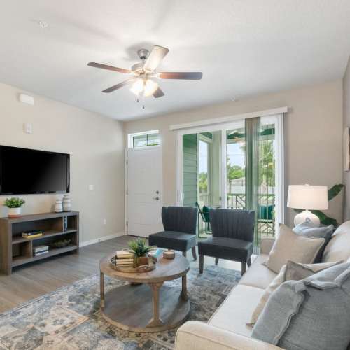 Well-furnished modern living area at The Bergamot Apartments On 780 in Sarasota, Florida