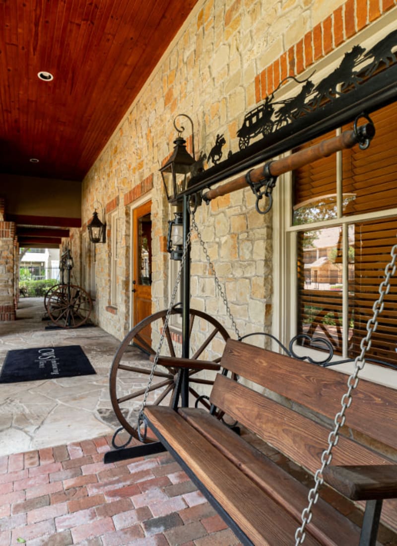 Antique swing bench outside main entrance to Marquis at Bellaire Ranch in Fort Worth, Texas