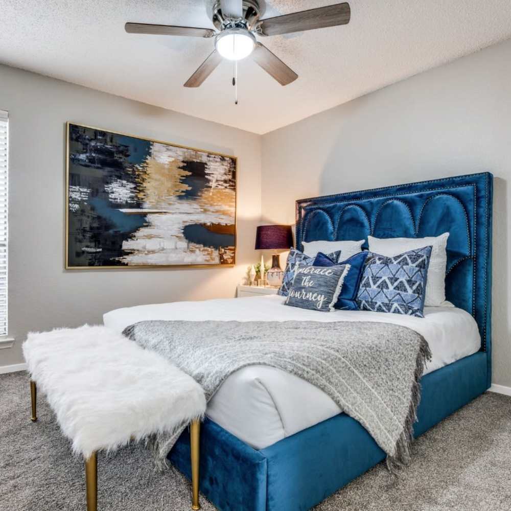 Well-furnished bedroom of an apartment home at Fountains of Jupiter in Dallas, Texas