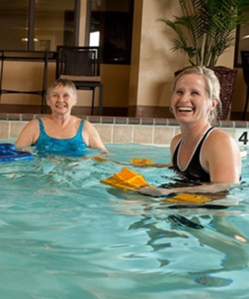 Residents swimming at Regency Newcastle in Newcastle, Washington